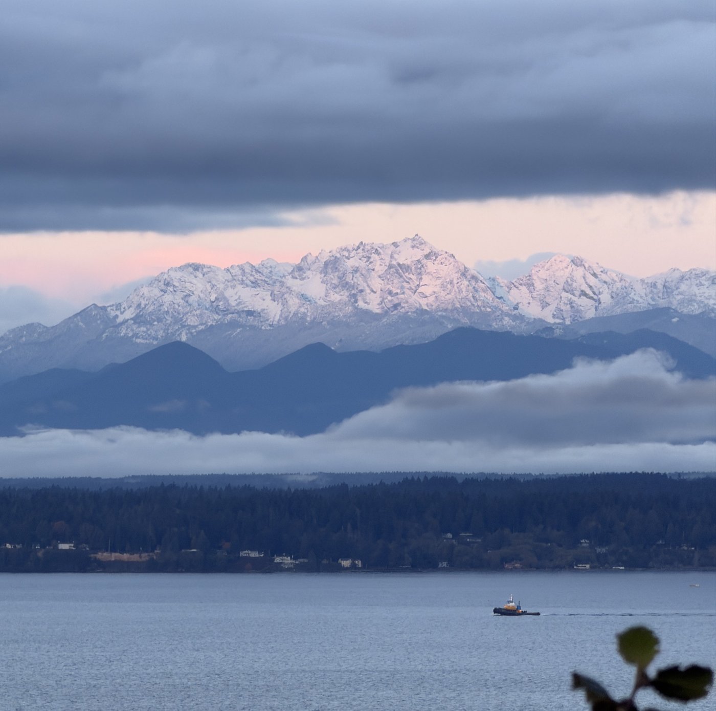 Snow-covered Olympic Mountains at sunset